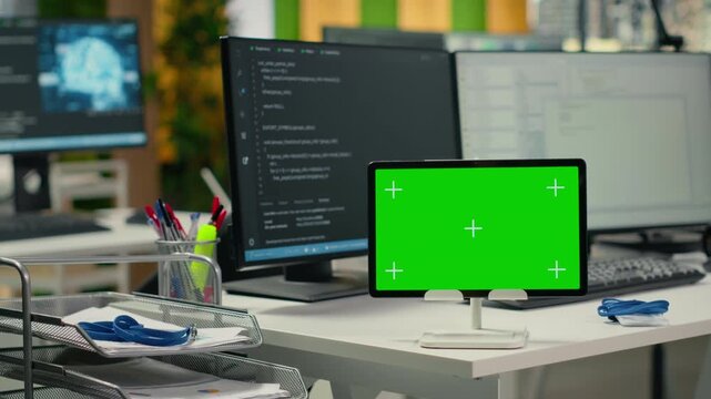 Isolated screen tablet on Silicon Valley startup office desk used to implement neural network algorithms. AI tech company workplace with mockup device used to conduct code reviews, close up