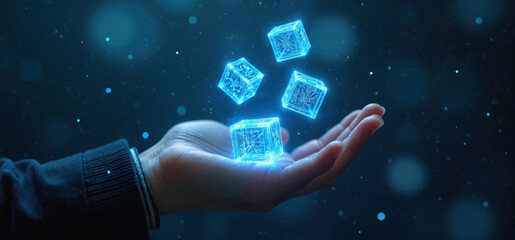 Hand holds glowing blue cubes with circuit patterns floating against dark background with digital particles. Represents futuristic tech, innovation, data, virtual reality, artificial intelligence.