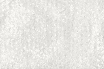 Demonstrating the colors of 2026 - Cloud Dancer. Abstract background made of white transparent bubble wrap packaging with space for text. Texture for creating backgrounds for designers.