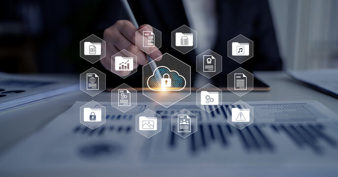 A business professional uses a digital tablet to illustrate data security with cloud technology and padlock symbols, emphasizing the importance of information management. Gantry