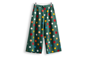 Green wide leg pants with colorful polka dot pattern isolated on transparent background
