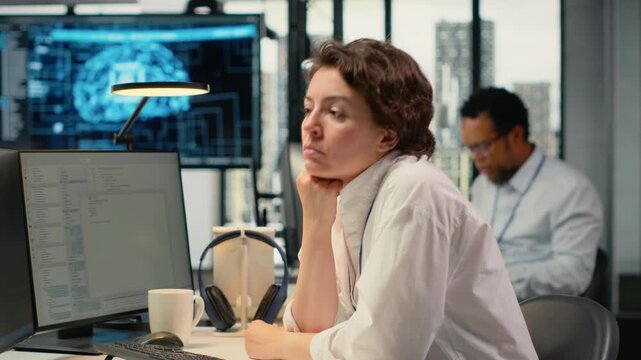 Cheerful technician working in office, using specialized hardware to accelerate complex AI calculations. Upbeat IT expert managing systems for machine learning training datasets, camera B