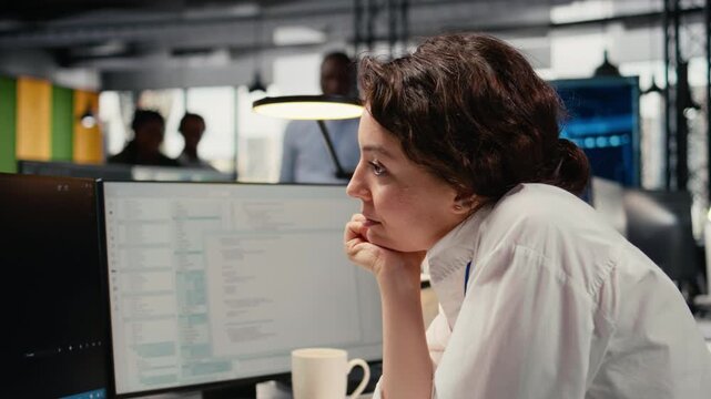 Close up of developer enjoying coffee while working in AI startup training predictive models for language processing tasks. Tech expert drinks beverage, uses technical expertise for IT tasks, camera A