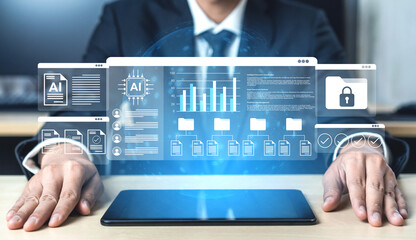 Fototapeta premium A business professional uses advanced AI technology visuals to analyze data in a modern office environment, illustrating innovation and digital strategies for growth. Gantry