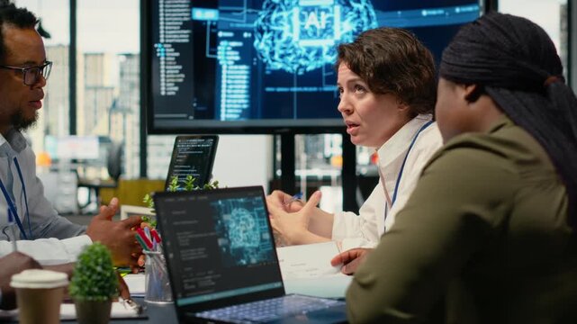 System administrators in startup office brainstorming leverage AI tech to gain competitive edge. . Management executives doing meeting to discuss training machine learning predictive models, camera B