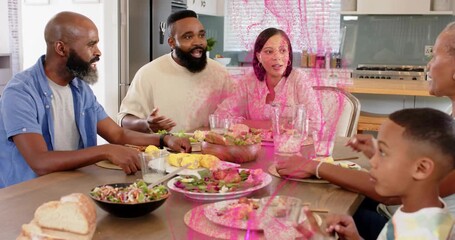 Family sitting around table sharing food for bonding, man gesturing sparking pink overlay growing