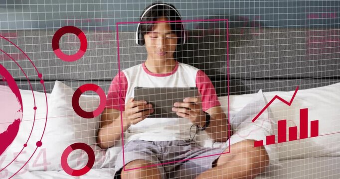 Teen boy sitting bed tapping tablet launching tech app framing subject, rising charts showing stats