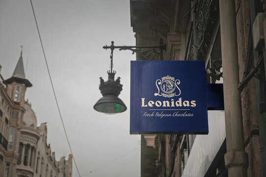 VALENCIA, SPAIN - APRIL 12, 2025: Street view of a Leonidas shop sign in Valencia, Spain. Confiseries Leonidas is a Belgian chocolate producer and retailer spread in Europe.