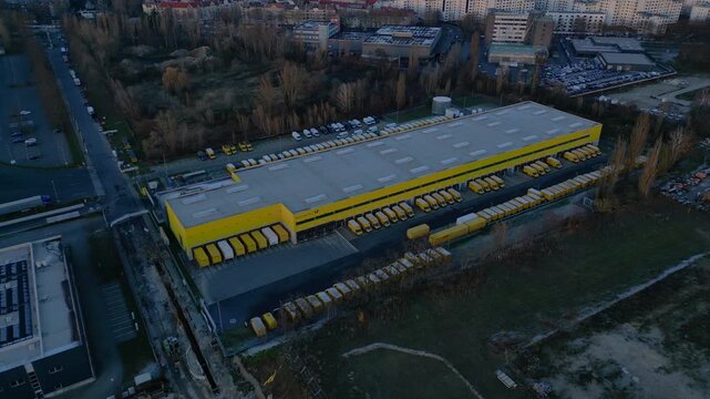 DHL Deutsche Post logistics center berlin city. Dramatic aerial view drone