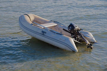 Small White Boat Floating on Calm Water, Seaside Scene with Gentle Waves in Gulfport, FL.
Sea water, reflecting soft light. The scene conveys solitude and peacefulness, ideal for travel, coastal lifes