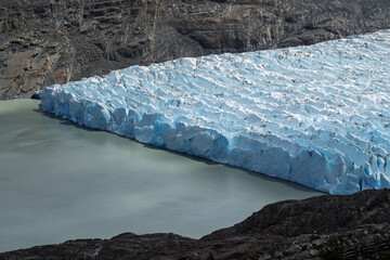 Massive blue terminal face of Grey Glacier meeting glacial lake, Chile