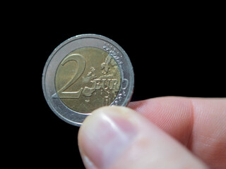 Two Euro Coin Close-Up Against Black Background
