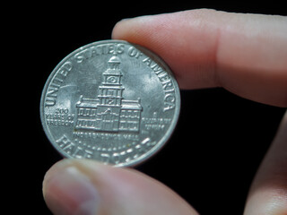 Close-Up Capture of a U.S. Quarter Coin with Historic Building