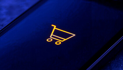 Smartphone close up glowing yellow cart icon