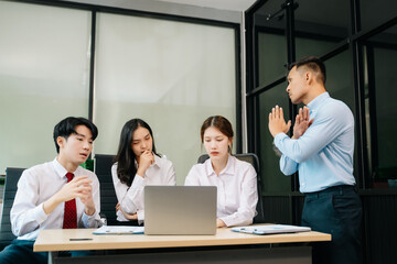 A business team in a tense office meeting, dealing with stress and frustration as they face a challenging project