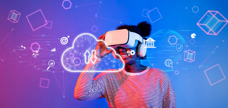 A woman is immersed in a virtual reality experience while interacting with digital cloud symbols and abstract graphics, showcasing the convergence of technology and creativity. XDMCP