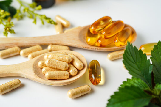Medicine herbal organic capsule vitamin E omega 3 fish oil drug herbs leaf natural supplements