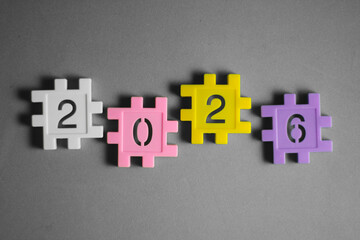 Colorful plastic number blocks arranged to form “2026,” creating a playful and bright New Year theme. Perfect for holiday greetings, education materials, and festive promotional designs.