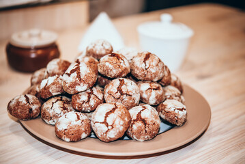 Chocolate crinkle cookies on brown plate