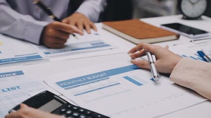 businesswoman using a calculator to calculate the numbers for financial document, finance accounting concept