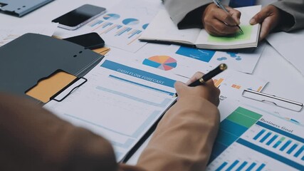 businesswoman using a calculator to calculate the numbers for financial document, finance accounting concept