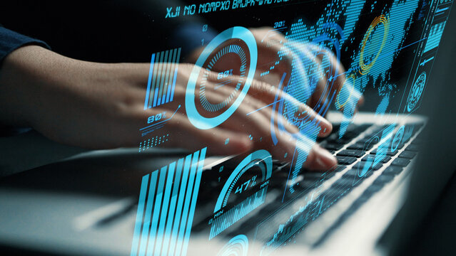 A modern workspace featuring a user typing on a laptop, surrounded by a digital interface showcasing data analytics and visualizations, emphasizing the future of data-driven business. Cipher