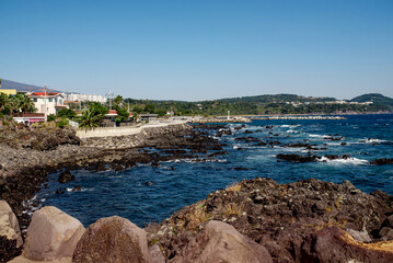Coastal view of Jeju Island showcasing rocky shores and clear waters, ideal for nature lovers and photographers
