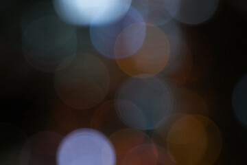 Blurred night background with colorful bokeh, copy space