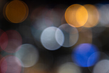 Blurred night background with colorful bokeh, copy space