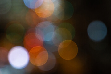 Blurred night background with colorful bokeh, copy space