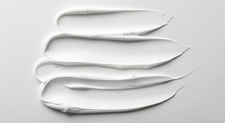 Obraz premium Trendy white color 2026 year. White cream smear texture for cosmetic background. Skin care product or lotion swatch. Beauty, hygiene and wellness concept with neutral minimalist design.