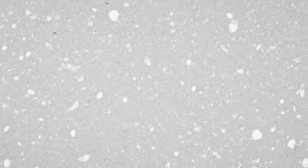 Trendy white color 2026 year. Light gray terrazzo texture background with white particulate elements. Modern decorative surface for interior design and construction concept.