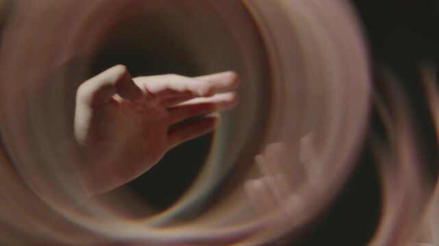Hands flipping through a book with soft motion blur, creating a calm, focused mood