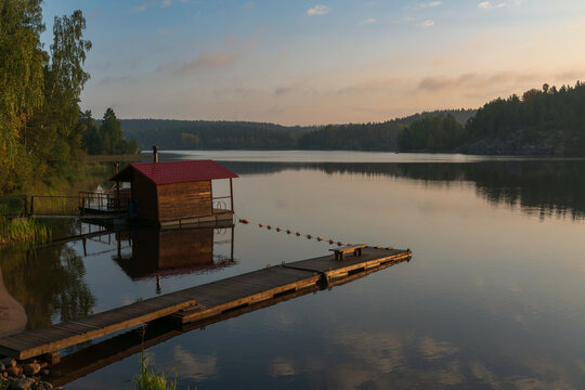 Wooden bathhouse on the shore of Lake Ladoga near the village of Lumivaara on a sunny autumn morning, Ladoga Skerries, Lahdenpohya, Republic of Karelia, Russia
