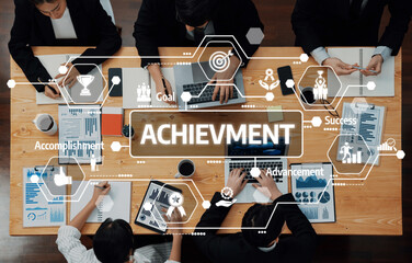 Obraz premium A diverse team engages in a productive meeting centered on achievement and strategic goals, surrounded by charts and data for business growth and success. Amity