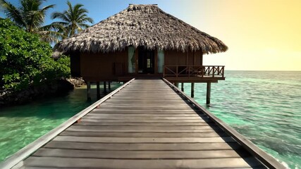 Tropical Maldives resort bungalow over turquoise lagoon water with jetty to the private island beach