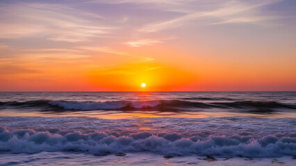 Obraz premium Beautiful ocean waves crashing on shore during a vibrant orange sunset with sunlight reflecting on the water's surface