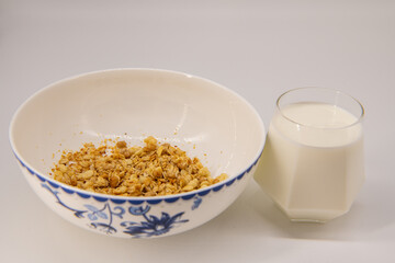 Granola Cereal bar with milk on Background Breakfast Healthy Food sweet dessert snack. Diet Nutrition Concept