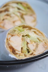 Delicious chicken wrap with fresh lettuce and sauce