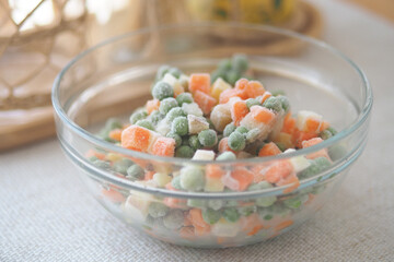 Frozen mixed vegetables in a glass bowl ready for cooking