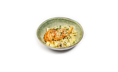 Creamy Chicken Pappardelle with Parmesan, Pine Nuts, and Chives in a Rustic Ceramic Bowl