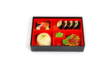 Japanese Bento Box with Sushi Rolls, Rice Ball, Stir-Fried Vegetables, and Greek Salad on White Background