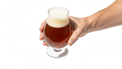 Hand holding a glass of amber beer with foam on a black background