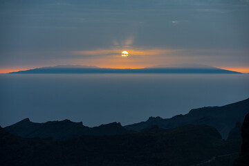 Sunset from Mirador de Cherfe: Macizo de Teno mountains, Masca Gorge. La Gomera island visible in...