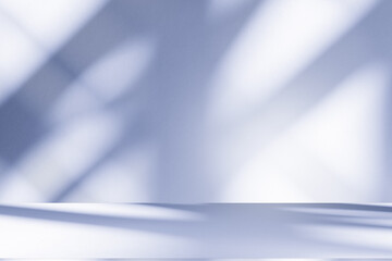 Wall interior background, studio and backdrops show products.with shadow from window color white and blue background for text insertion and presentation product	