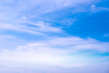 A bright, clear blue sky meets a glowing white horizon, suggesting a serene, open, and with sunlight of beautiful cloudy sky. landscape or abstract background.	
