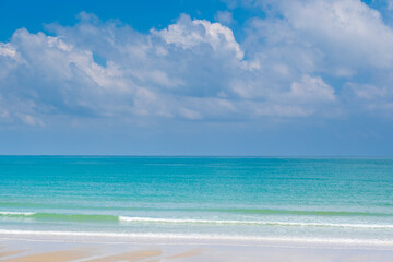 Nature of the ocean and blue sky Summer with sunshine, sandy beaches, clear blue waters sparkling against the blue sky. on an island with good ecology and environment Background for summer vacation