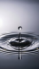 Mesmerizing impact of a single water droplet creating perfect circular ripples and reflections