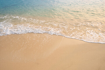 Beach sand background for summer vacation concept. Beach nature and summer seawater with sunlight light sandy beach Sparkling sea water 