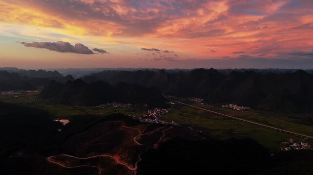 Epic Pre-Typhoon Sunset: Massive, Well-Defined Cloud Formations Glowing Over Karst Hills
